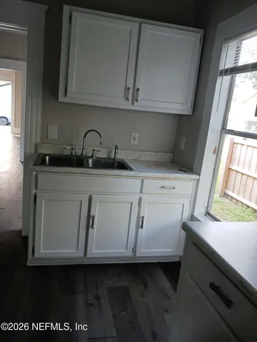 a stove top oven sitting inside of a kitchen
