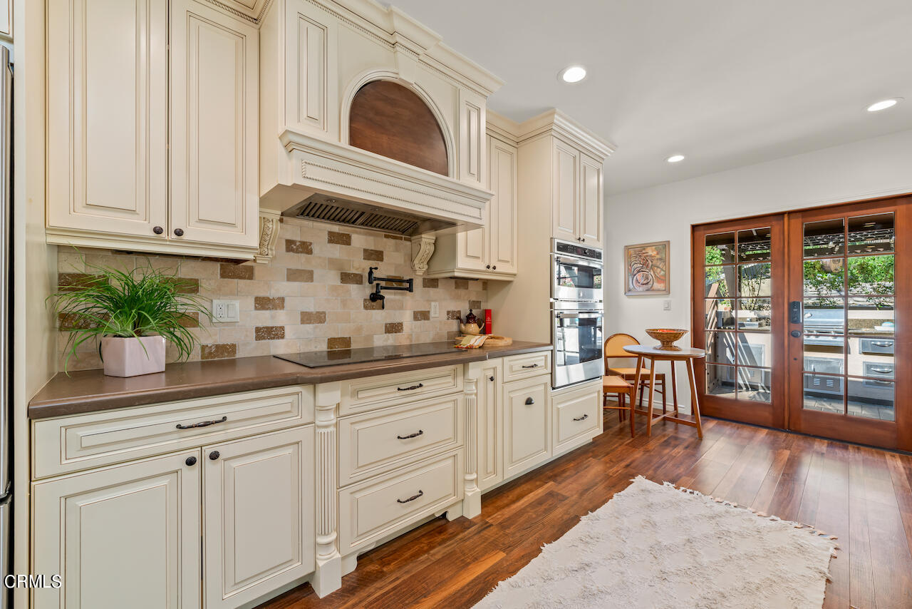 1425 Hillside Drive Glendale, CA 91208 - Photo 15 of 68 a kitchen with sink cabinets and wooden floor