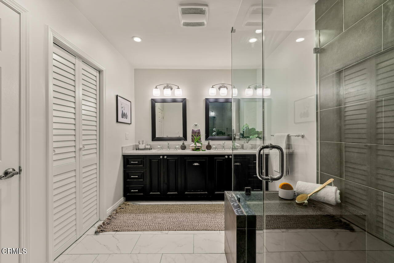 1425 Hillside Drive Glendale, CA 91208 - Photo 27 of 68 a bathroom with a double vanity sink and a mirror