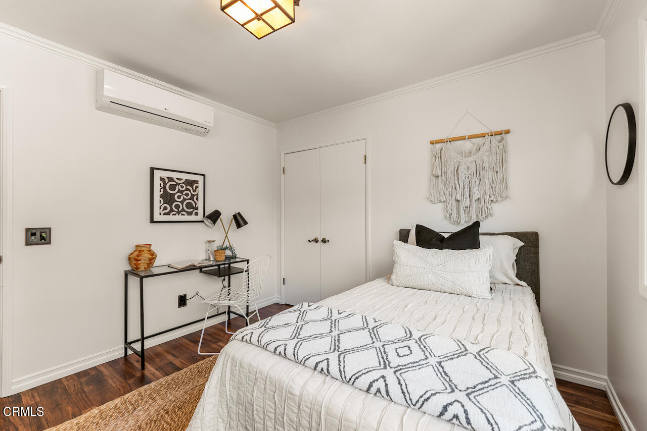1425 Hillside Drive Glendale, CA 91208 - Photo 35 of 68 a bedroom with a bed and wooden floor