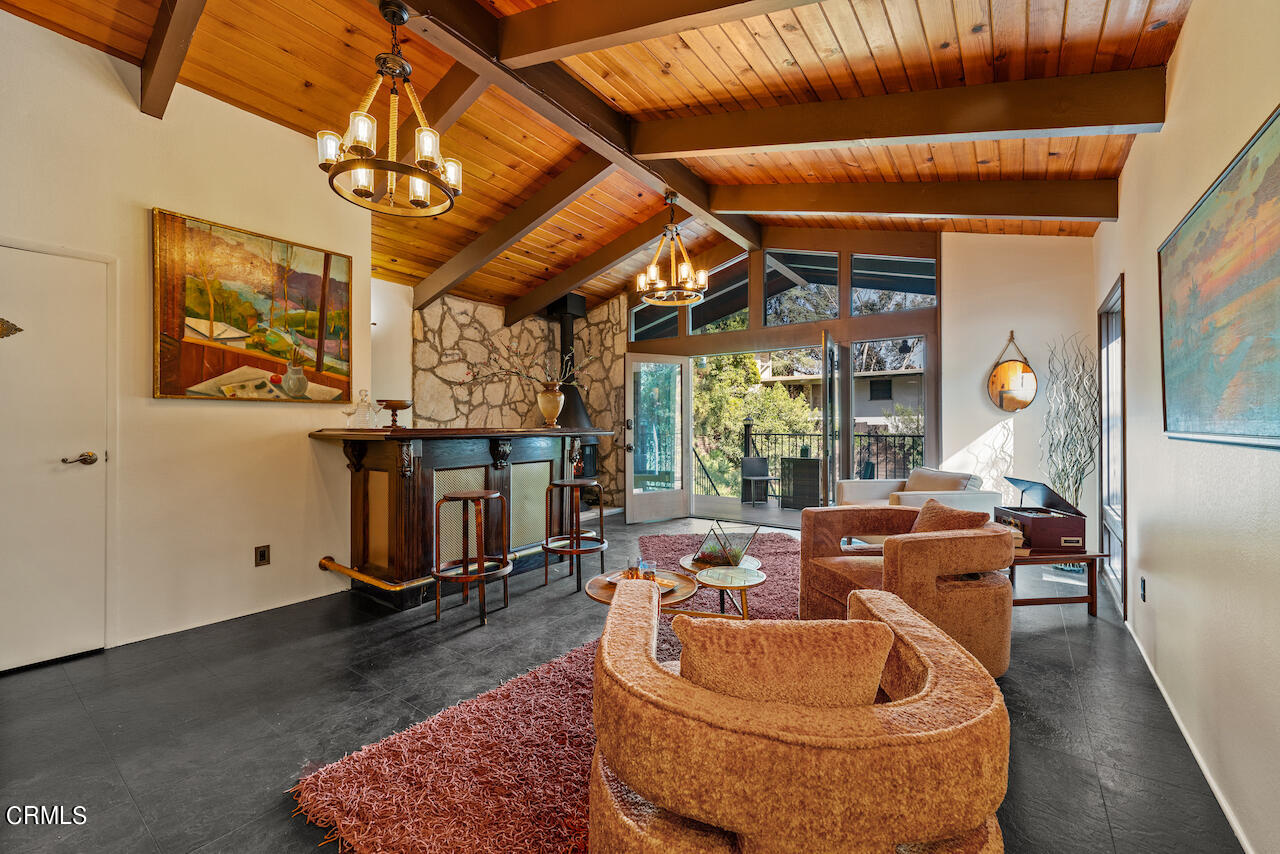 1425 Hillside Drive Glendale, CA 91208 - Photo 38 of 68 a room with gym equipment and a chandelier