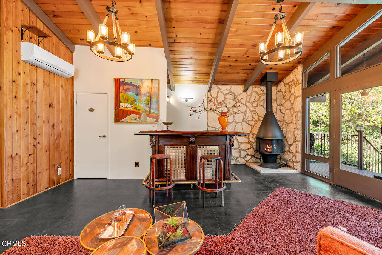 1425 Hillside Drive Glendale, CA 91208 - Photo 43 of 68 a living room with furniture a rug and a chandelier