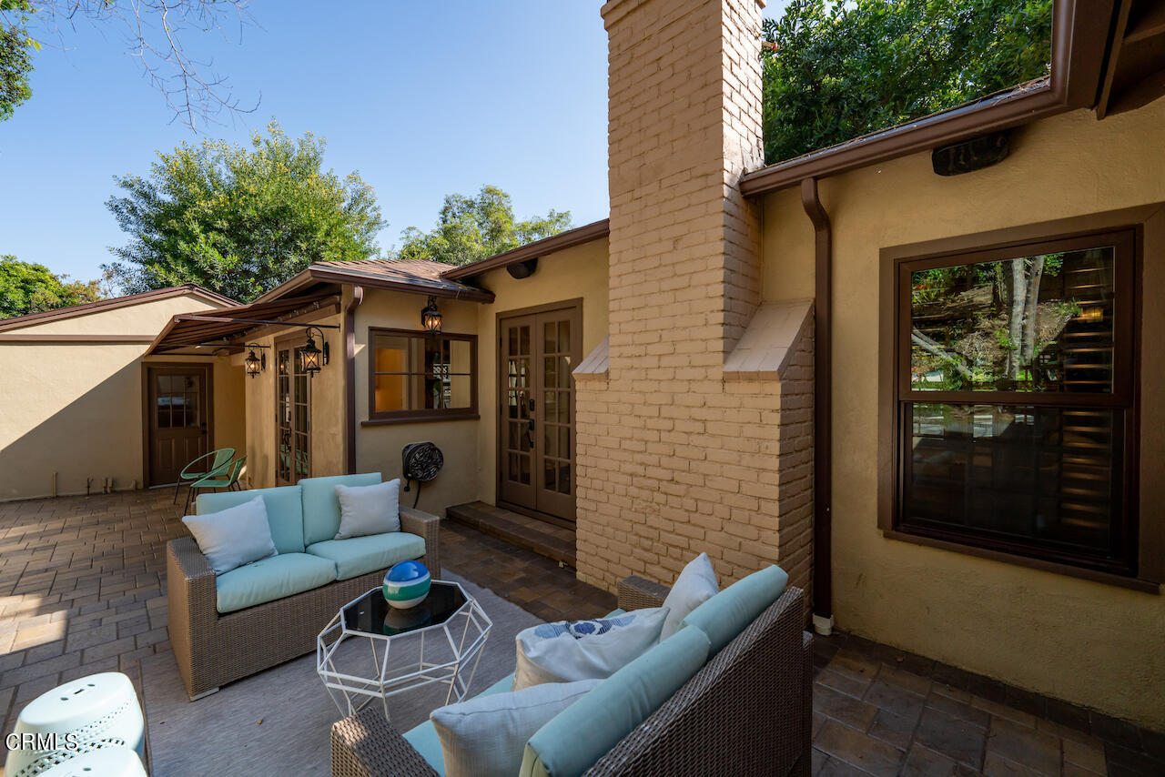 1425 Hillside Drive Glendale, CA 91208 - Photo 57 of 68 a view of a patio with couches table and chairs with wooden floor and fence