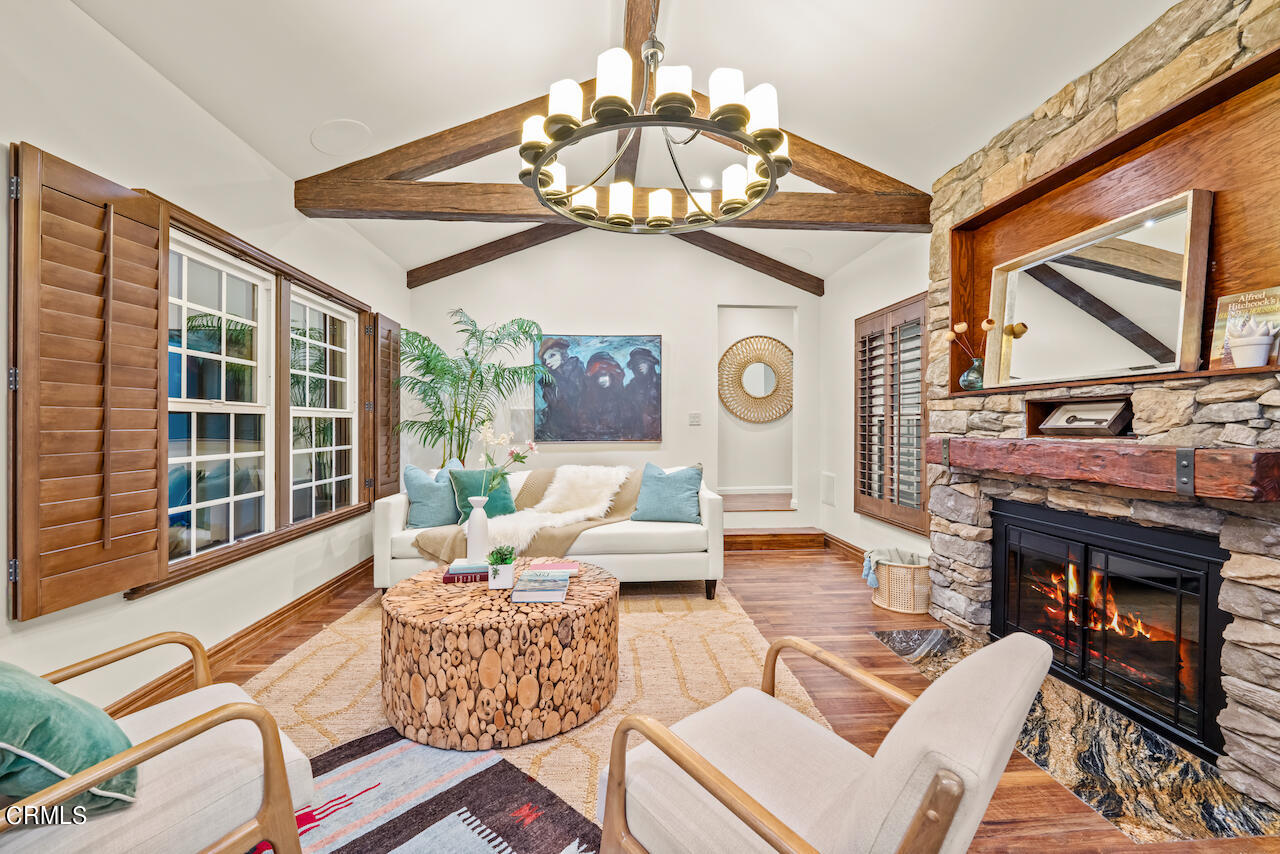 1425 Hillside Drive Glendale, CA 91208 - Photo 9 of 68 a living room with furniture a fireplace and a chandelier