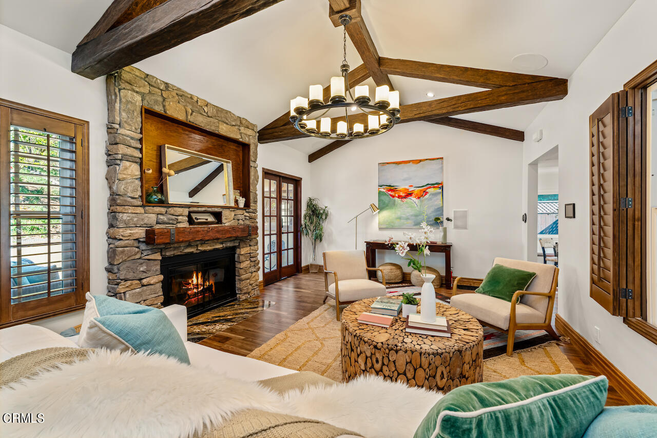 1425 Hillside Drive Glendale, CA 91208 - Photo 10 of 68 a living room with furniture a fireplace and a flat screen tv