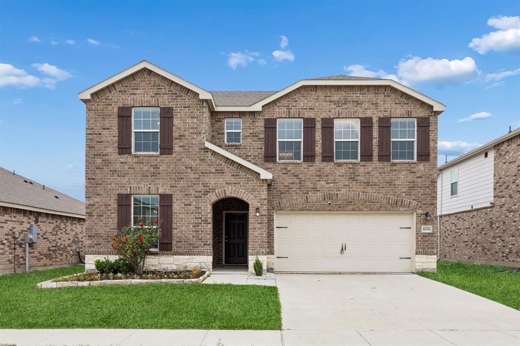 1006 Voca Dr. Forney, TX 75126 - Photo 1 of 26 a front view of a house with a yard and garage