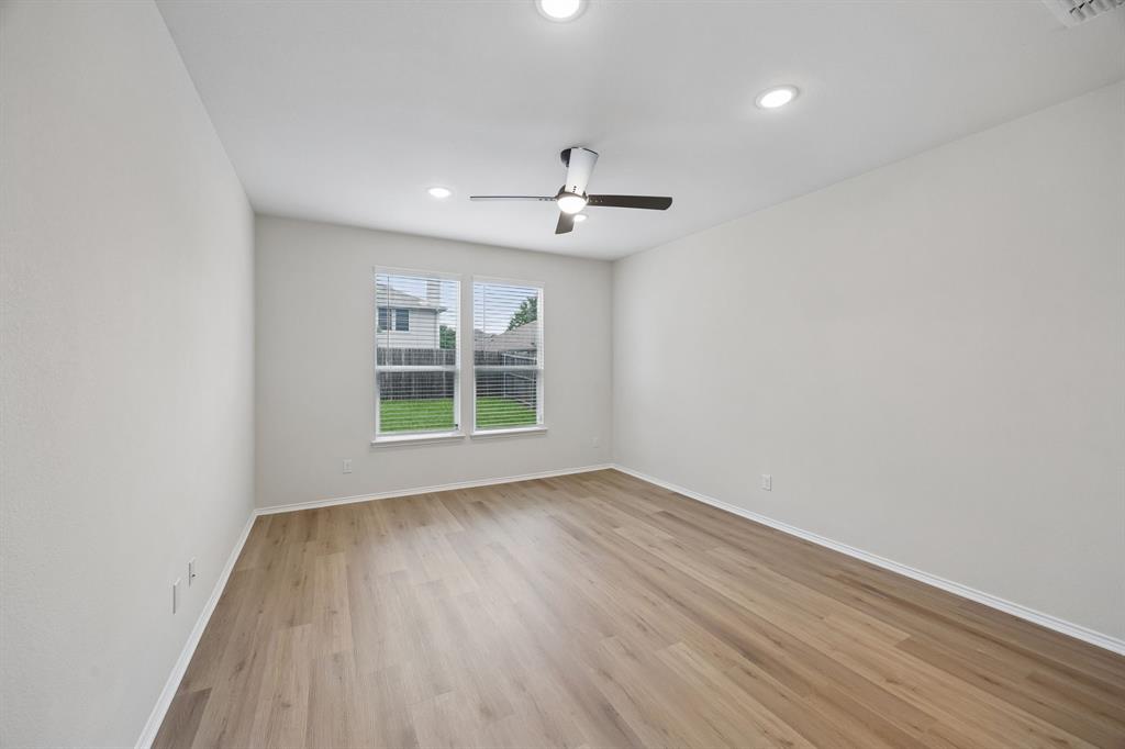 1006 Voca Dr. Forney, TX 75126 - Photo 14 of 26 wooden floor in an empty room with a window
