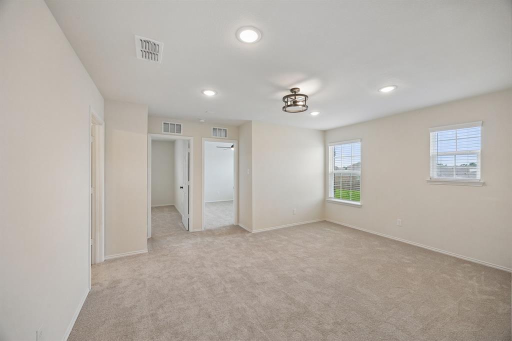 1006 Voca Dr. Forney, TX 75126 - Photo 19 of 26 an empty room with windows and closet