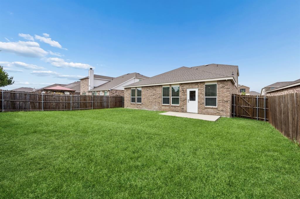 1006 Voca Dr. Forney, TX 75126 - Photo 25 of 26 a view of a house with backyard and porch