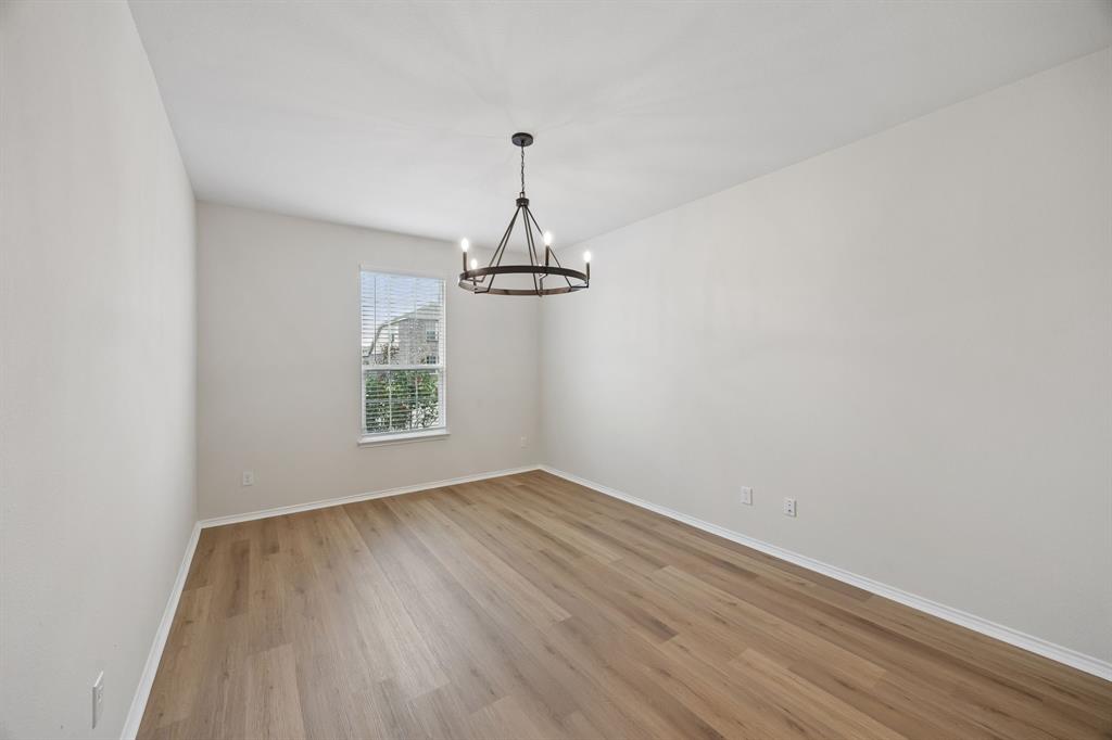 1006 Voca Dr. Forney, TX 75126 - Photo 3 of 26 wooden floor in an empty room with a window