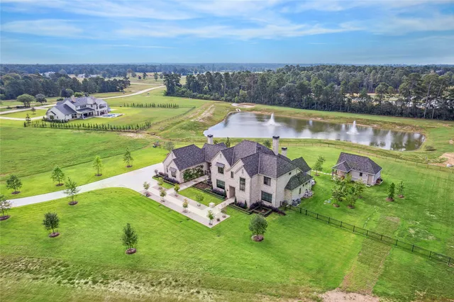 an aerial view of a house with a garden