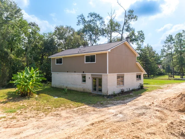 a view of a house with a big yard