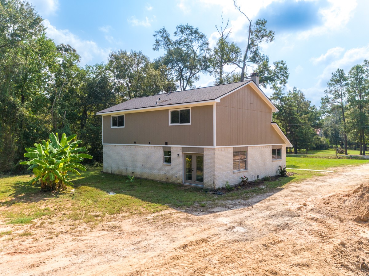 13087 Crystal Trail Conroe, TX 77306 - Photo 11 of 47 a house with trees in the background