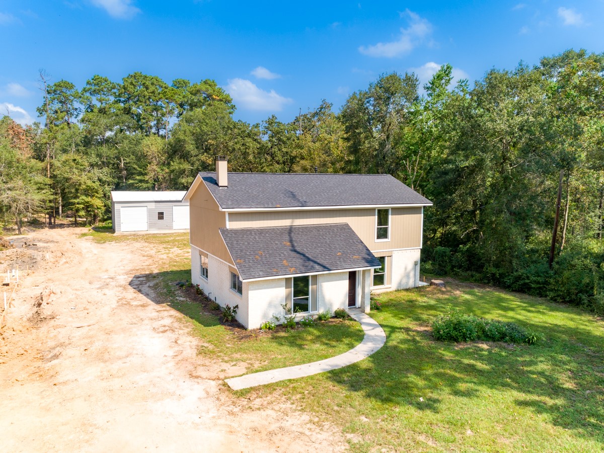 13087 Crystal Trail Conroe, TX 77306 - Photo 12 of 47 a view of a house with a big yard
