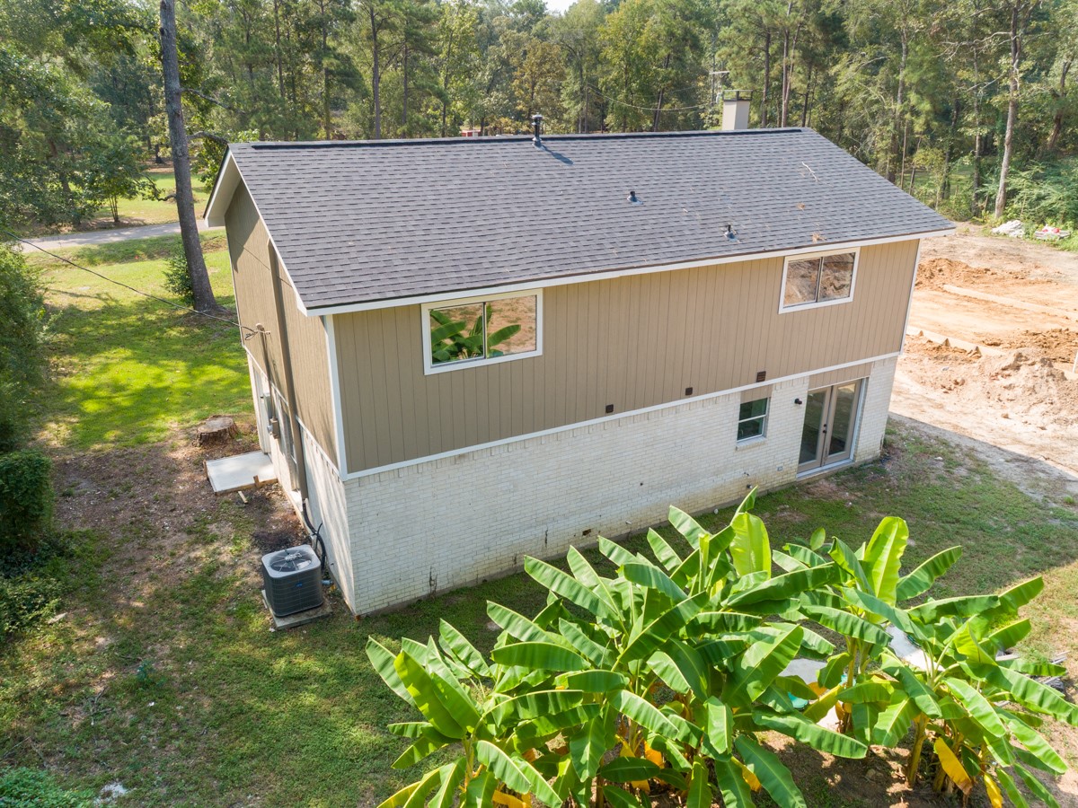 13087 Crystal Trail Conroe, TX 77306 - Photo 13 of 47 a view of house with backyard