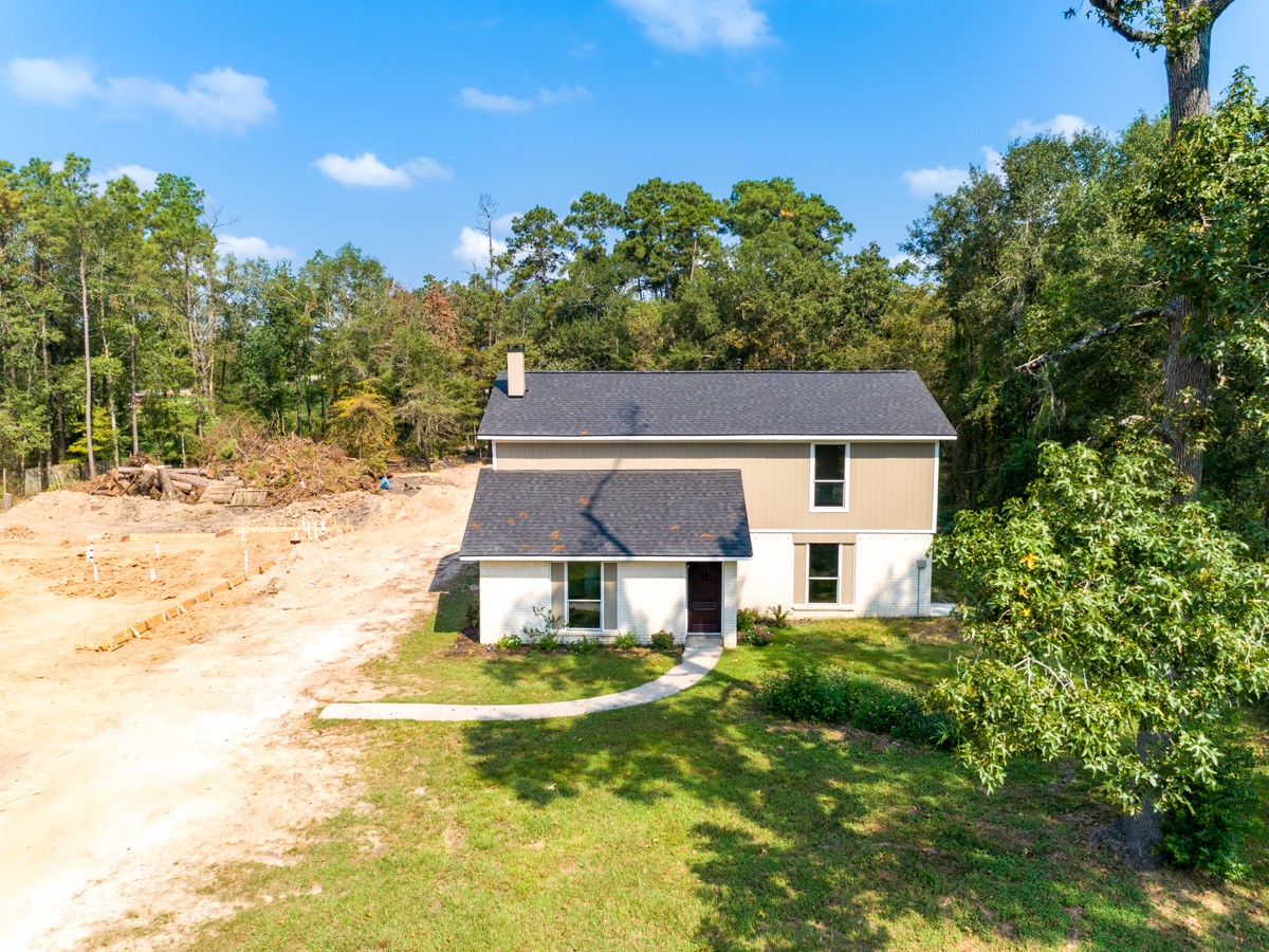 13087 Crystal Trail Conroe, TX 77306 - Photo 14 of 47 a aerial view of a house with a yard table and chairs