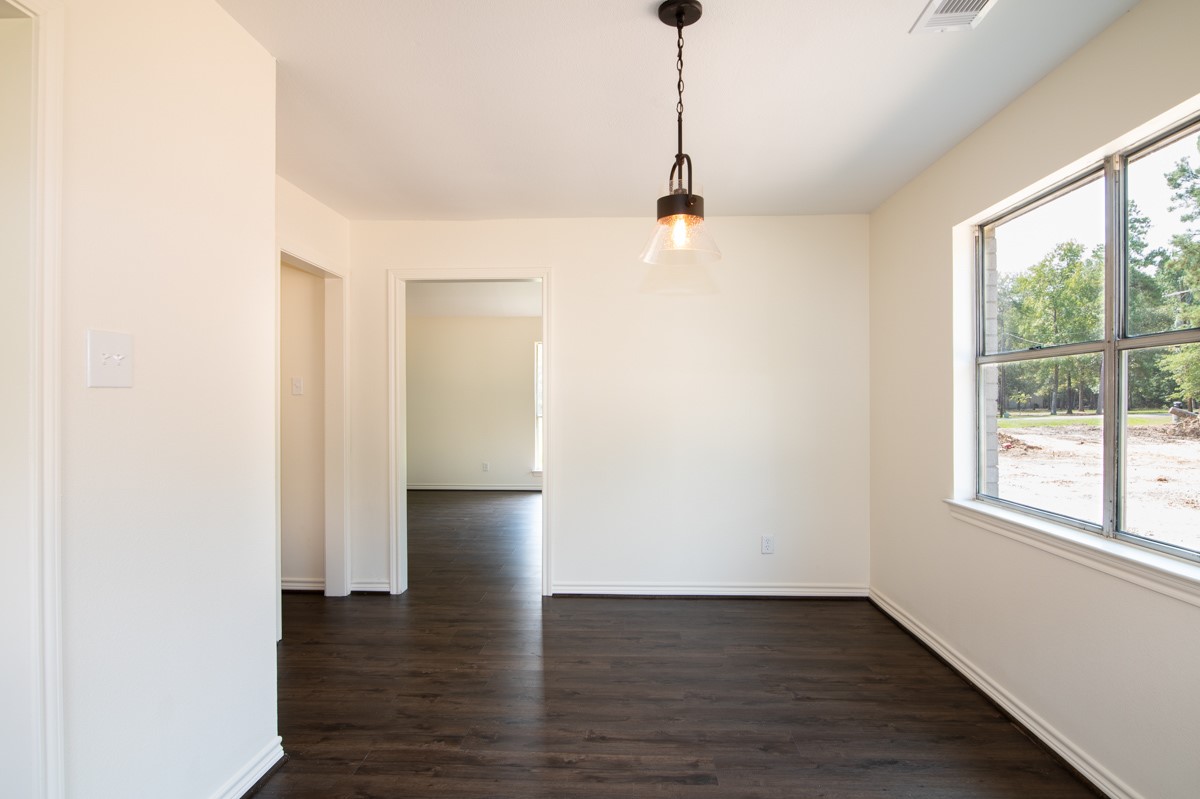 13087 Crystal Trail Conroe, TX 77306 - Photo 21 of 47 a view of empty room with wooden floor and fan