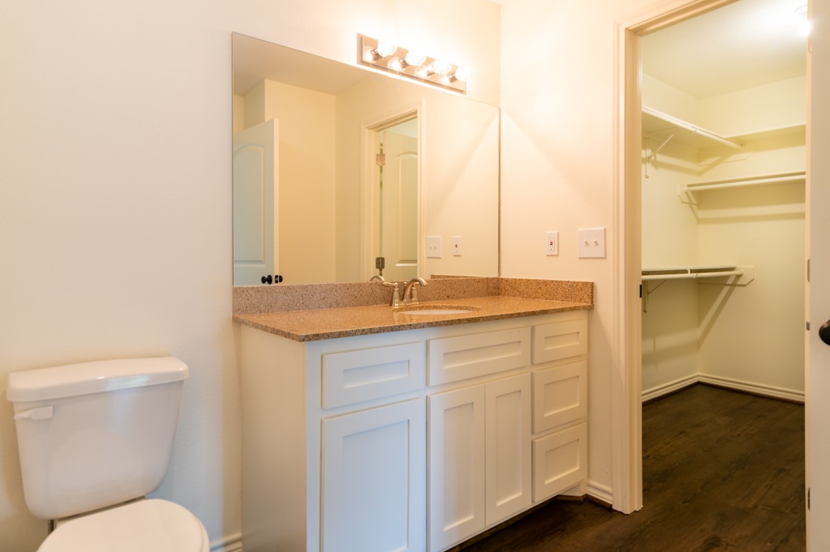 13087 Crystal Trail Conroe, TX 77306 - Photo 24 of 47 a bathroom with a granite countertop sink toilet and shower