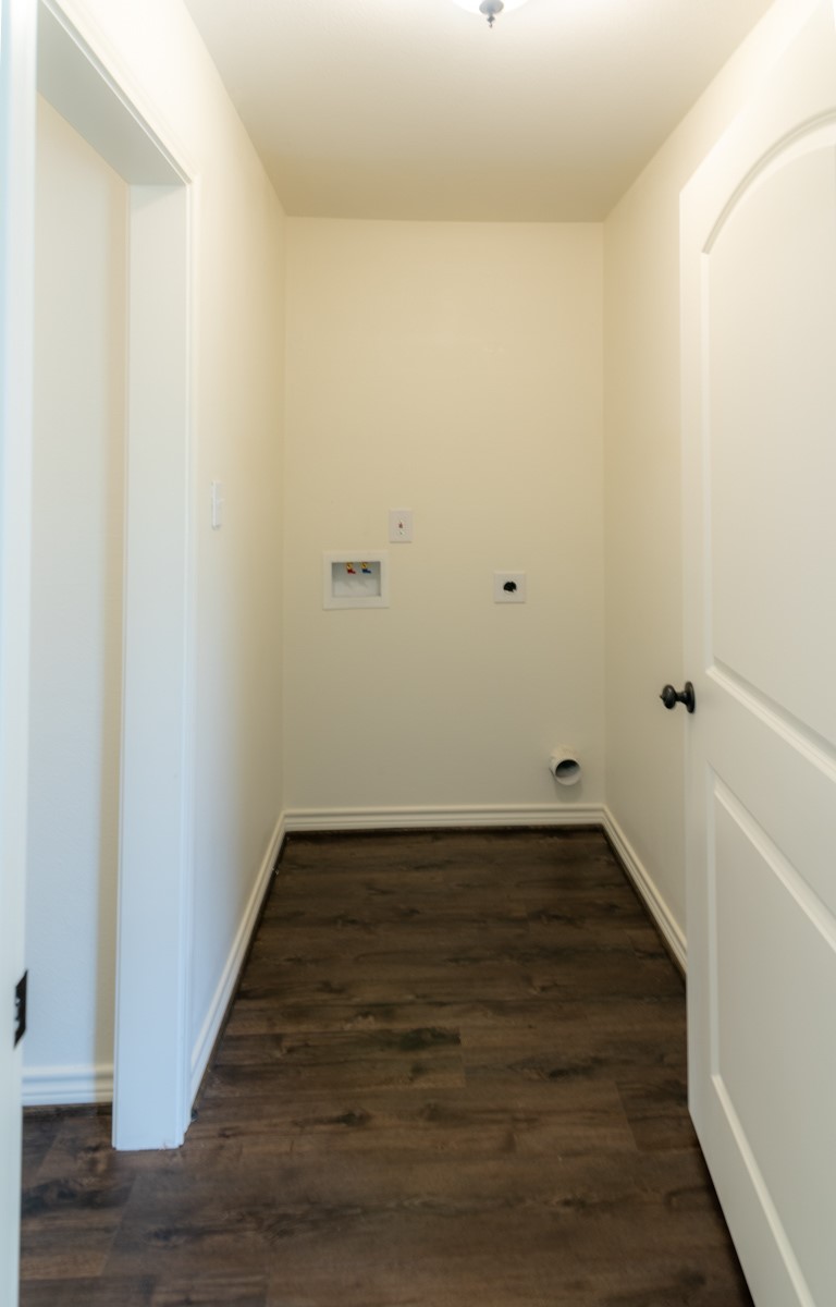 13087 Crystal Trail Conroe, TX 77306 - Photo 27 of 47 a view of a room with wooden floor and white walls