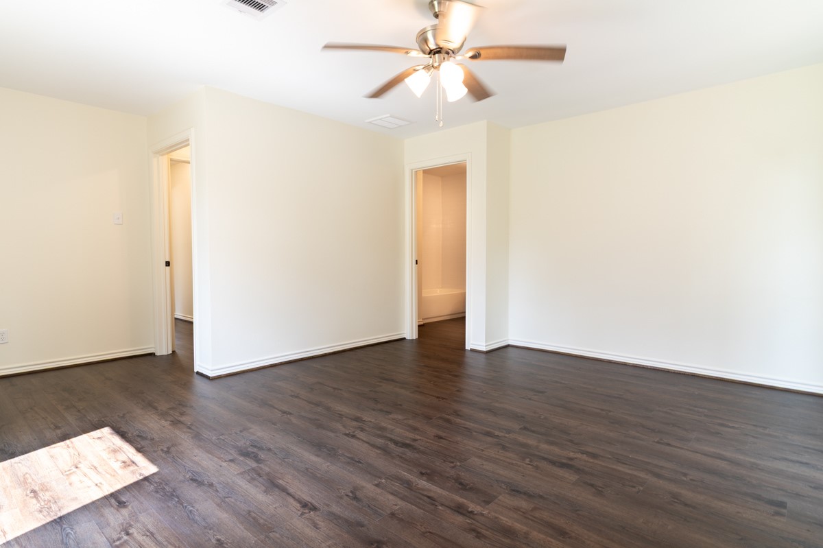 13087 Crystal Trail Conroe, TX 77306 - Photo 30 of 47 a view of an empty room with wooden floor