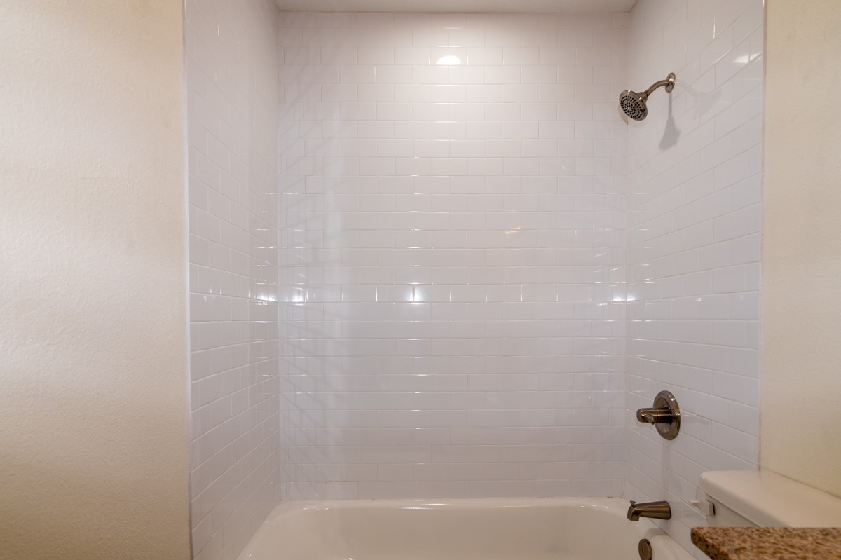 13087 Crystal Trail Conroe, TX 77306 - Photo 33 of 47 a bathroom with a bathtub