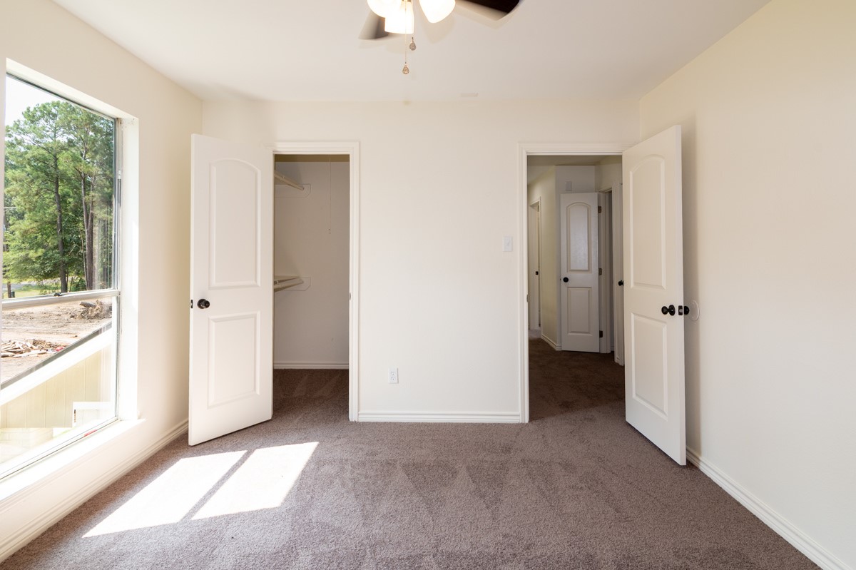 13087 Crystal Trail Conroe, TX 77306 - Photo 37 of 47 a view of an empty room with a window
