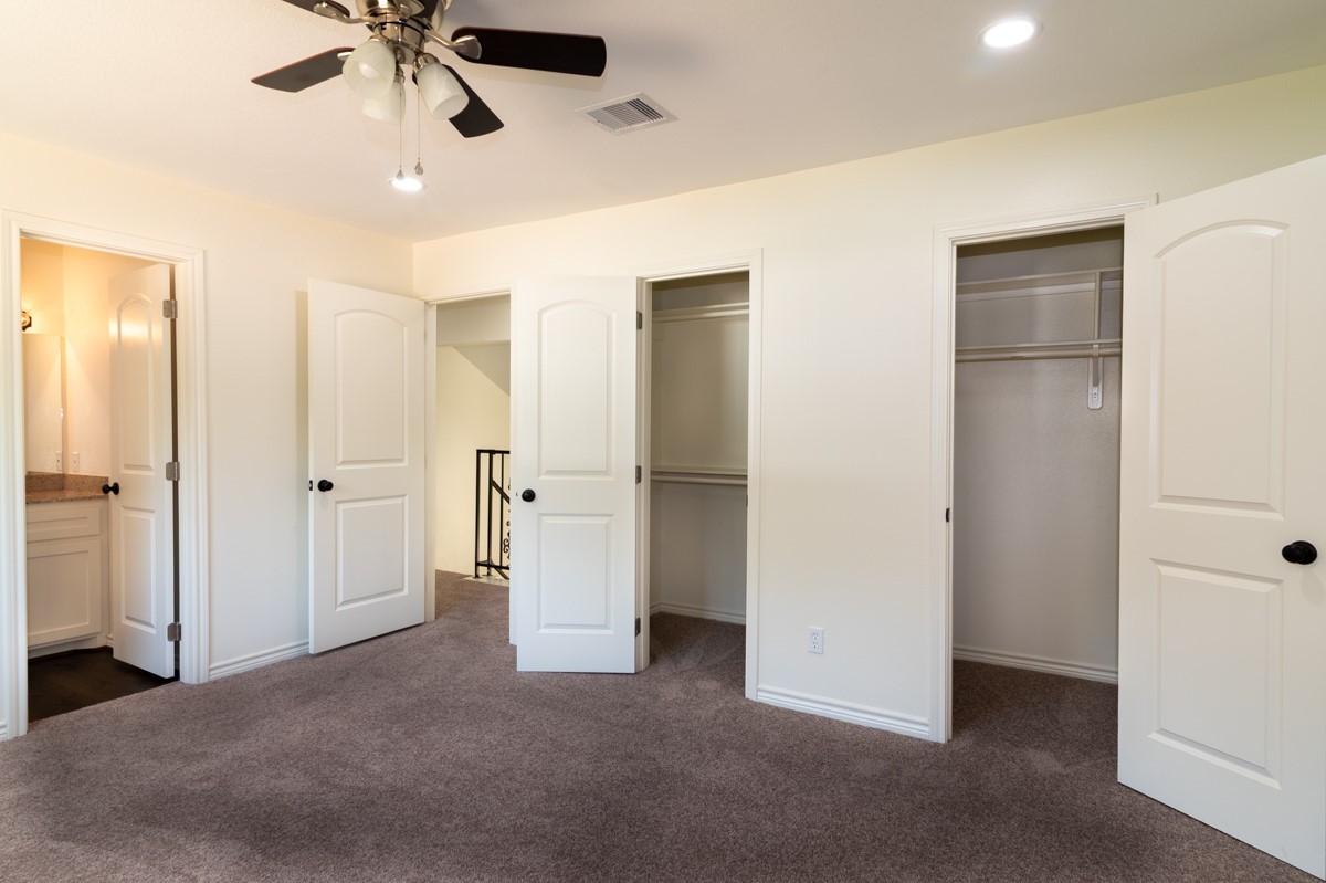 13087 Crystal Trail Conroe, TX 77306 - Photo 42 of 47 an empty room with closet and a ceiling fan