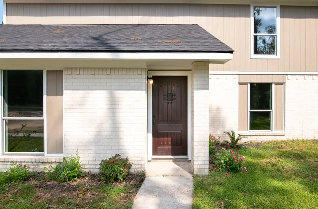 a front view of a house with a yard