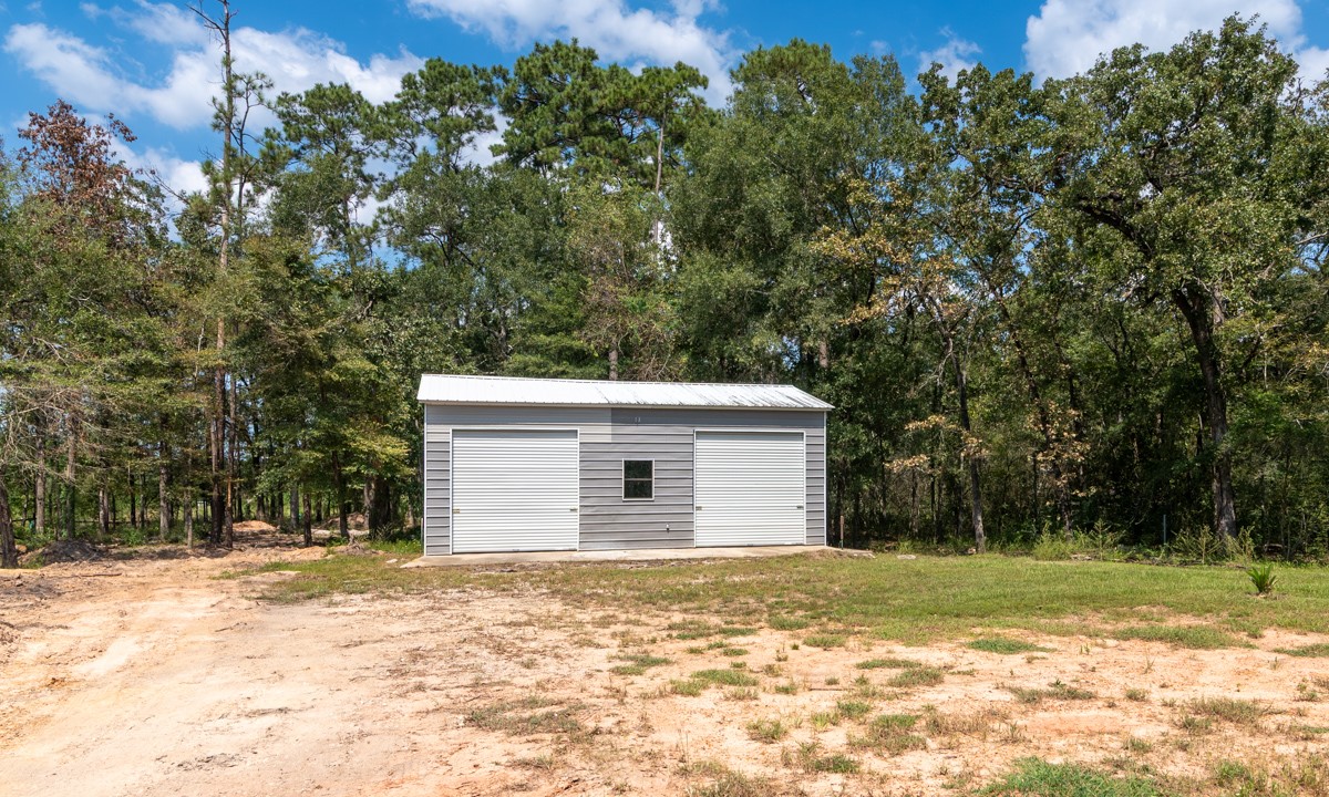 13087 Crystal Trail Conroe, TX 77306 - Photo 8 of 47 a view of a house with a yard