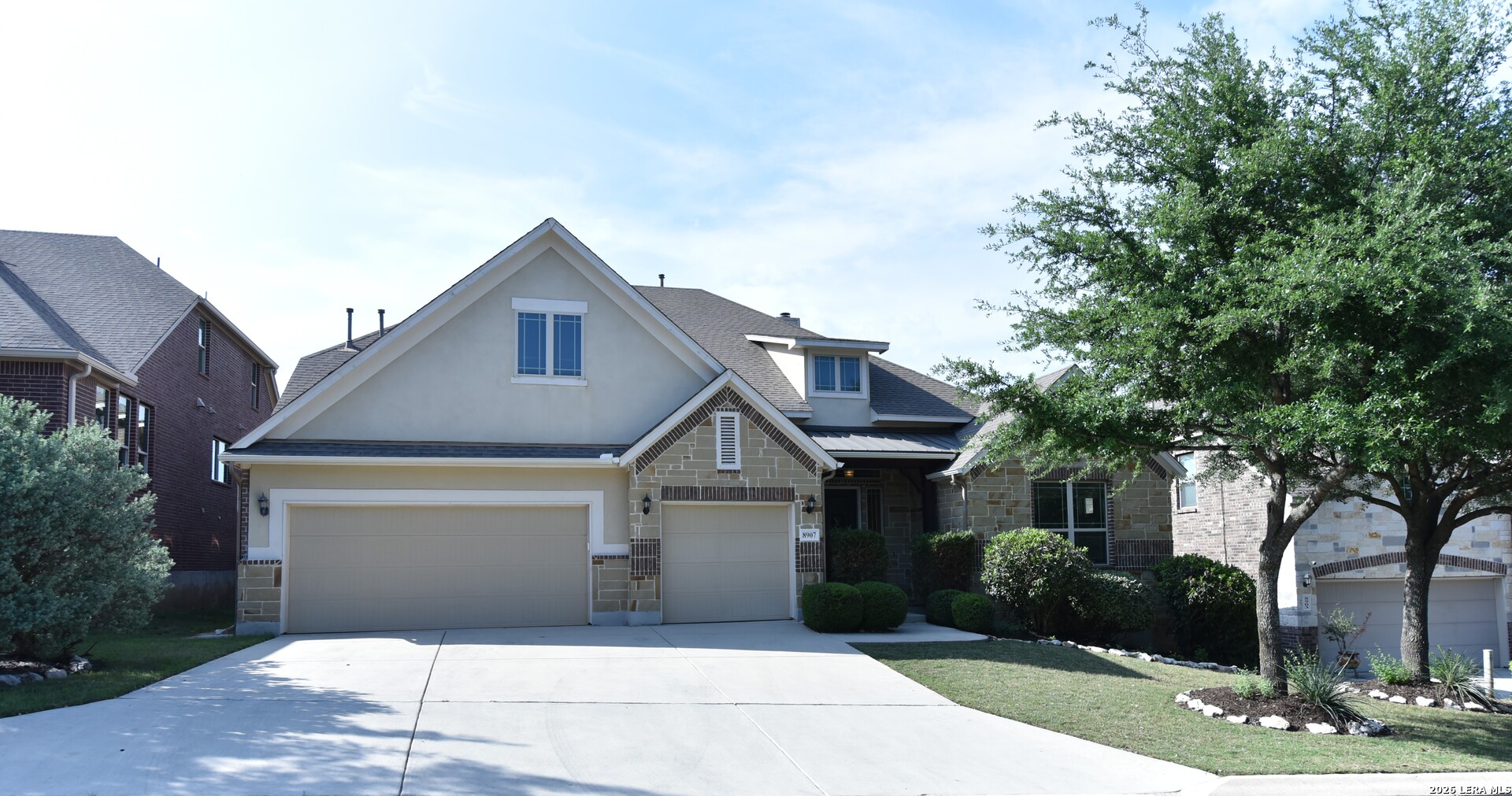 8907 Irving Hill Fair Oaks Ranch, TX 78015 - Photo 1 of 42 a front view of a house with garden