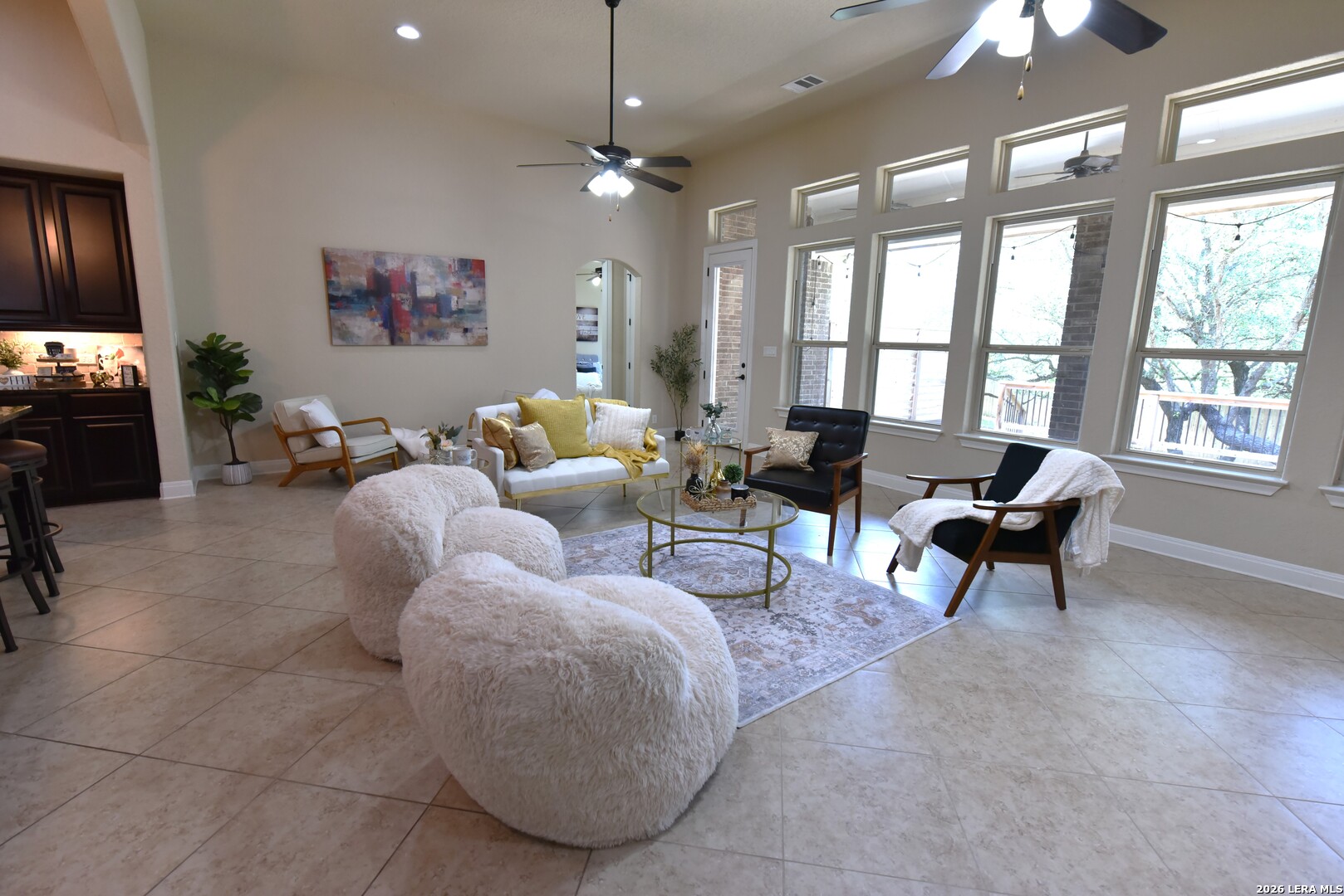 8907 Irving Hill Fair Oaks Ranch, TX 78015 - Photo 11 of 42 a living room with furniture and a chandelier