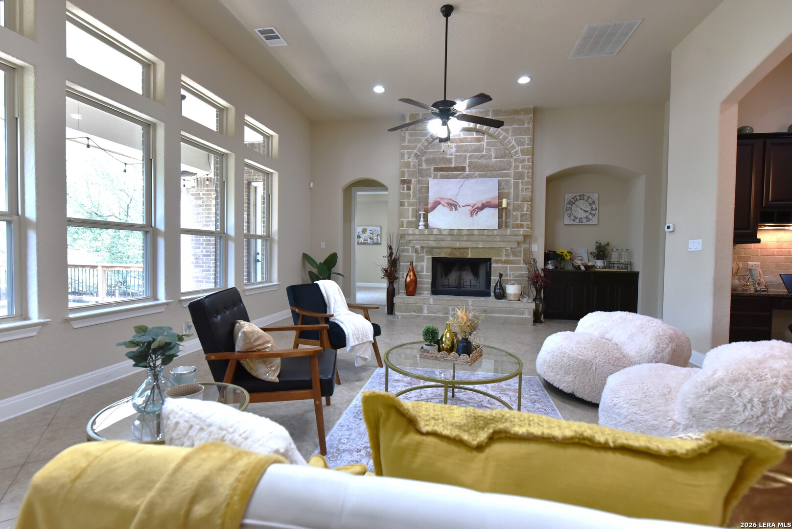 8907 Irving Hill Fair Oaks Ranch, TX 78015 - Photo 12 of 42 a living room with fireplace furniture and a chandelier
