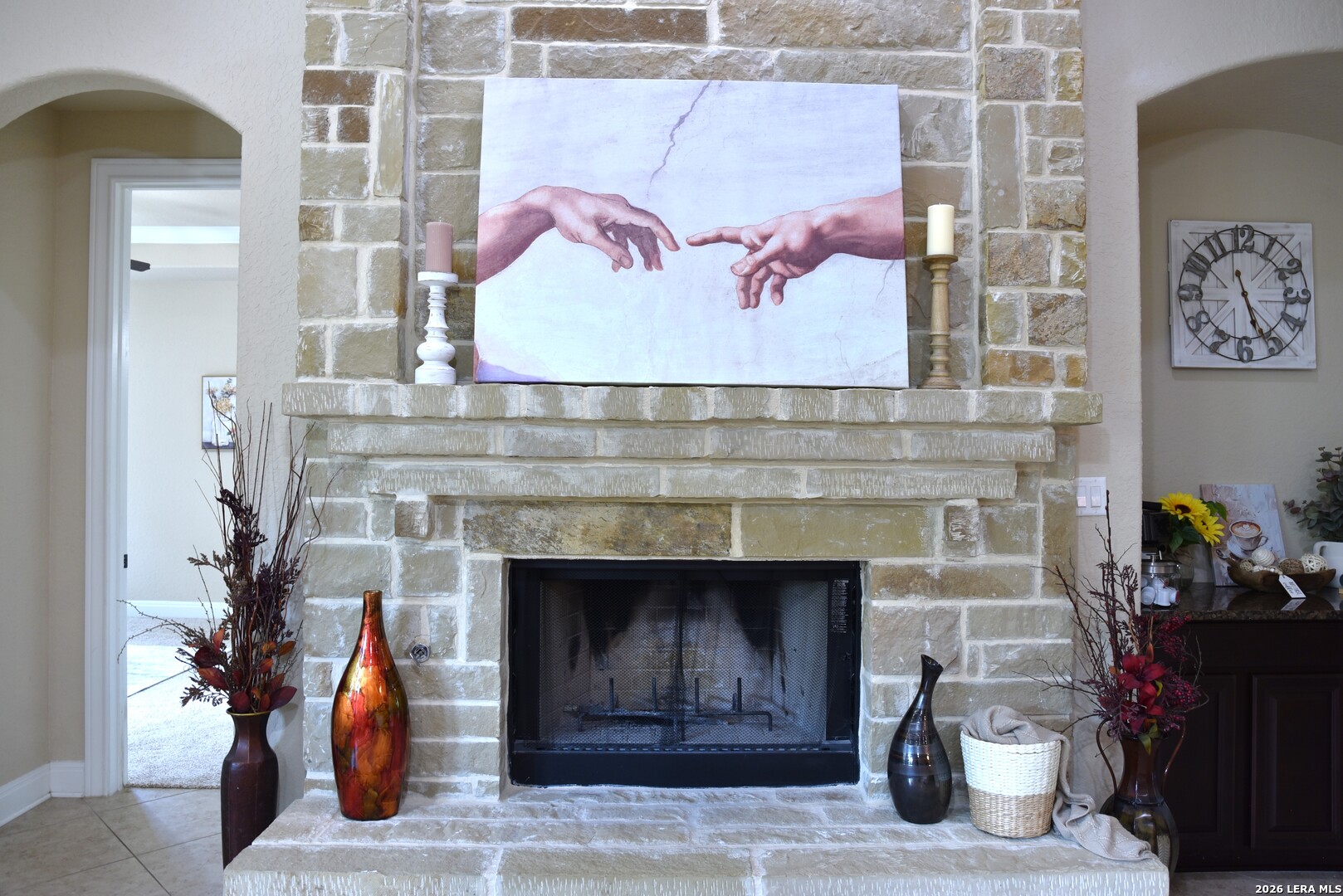 8907 Irving Hill Fair Oaks Ranch, TX 78015 - Photo 13 of 42 a living room with furniture and a fireplace