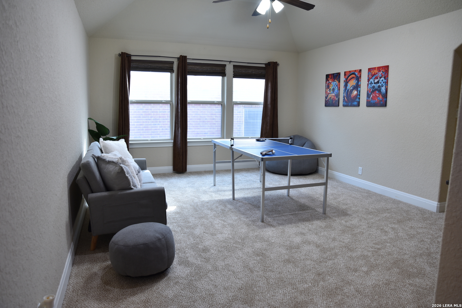 8907 Irving Hill Fair Oaks Ranch, TX 78015 - Photo 30 of 42 a living room with furniture and a large window