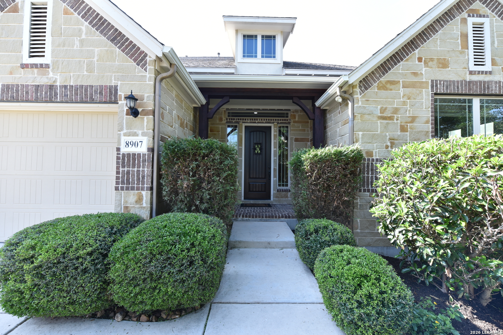 8907 Irving Hill Fair Oaks Ranch, TX 78015 - Photo 3 of 42 a view of a house with potted plants