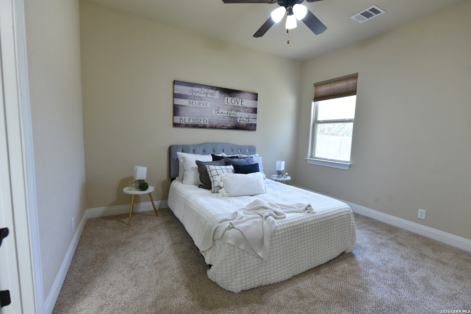 8907 Irving Hill Fair Oaks Ranch, TX 78015 - Photo 36 of 42 a bedroom with a bed and a chandelier