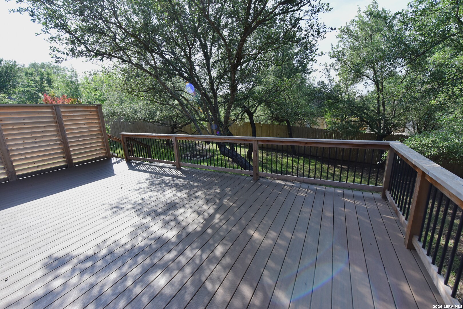 8907 Irving Hill Fair Oaks Ranch, TX 78015 - Photo 39 of 42 a view of balcony with wooden floor and fence
