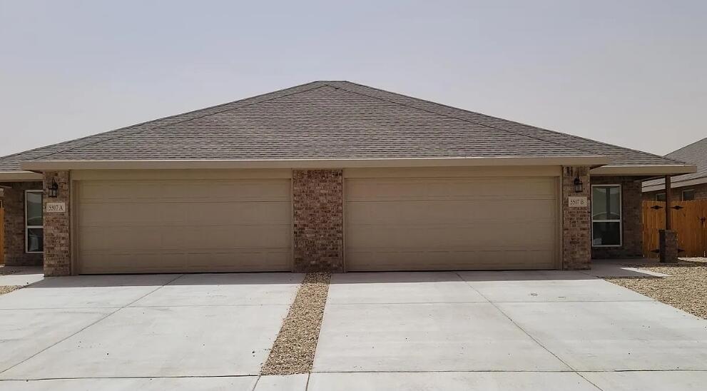 5524 Jarvis Street, Unit B Lubbock, TX 79416 - Photo 1 of 13 a front view of a house