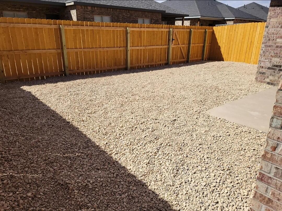 5524 Jarvis Street, Unit B Lubbock, TX 79416 - Photo 13 of 13 a view of a backyard with wooden fence