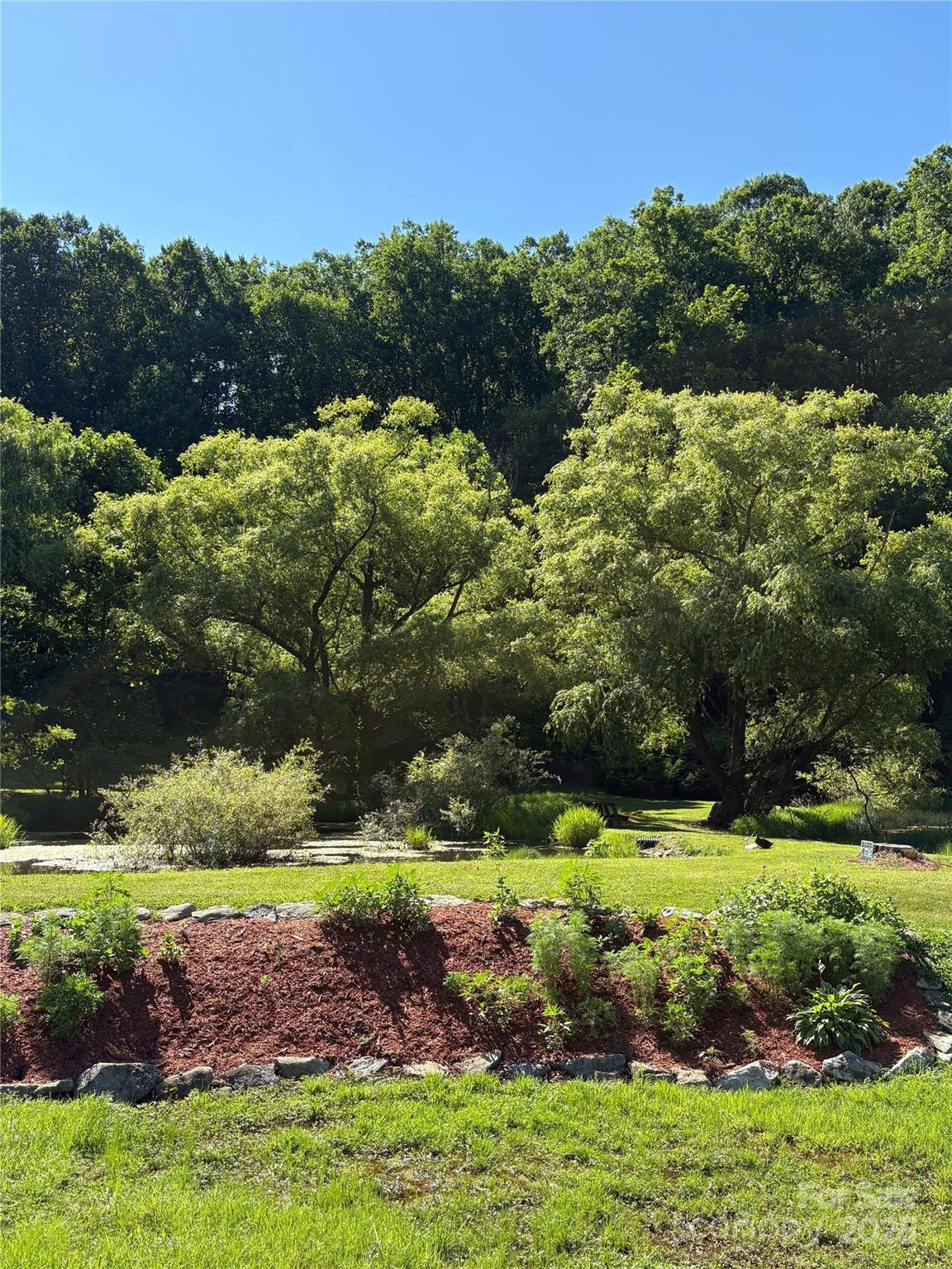 0 Slippery Rock Road, Unit 306 & 307 Waynesville, NC 28785 - Photo 21 of 25 a view of an outdoor space with yard