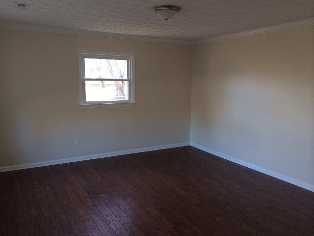 889 Augusta Farms Road Stuarts Draft, VA 24477 - Photo 10 of 10 an empty room with wooden floor and windows