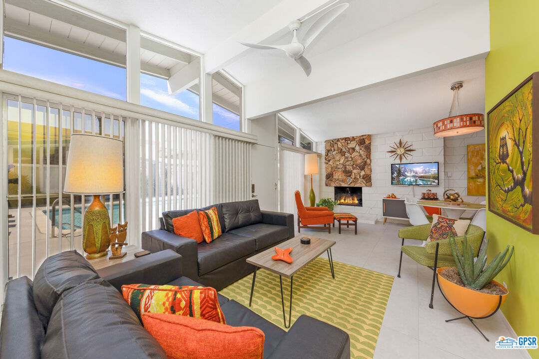 1655 Andee Drive Palm Springs, CA 92264 - Photo 11 of 23 a living room with furniture a couch and a window