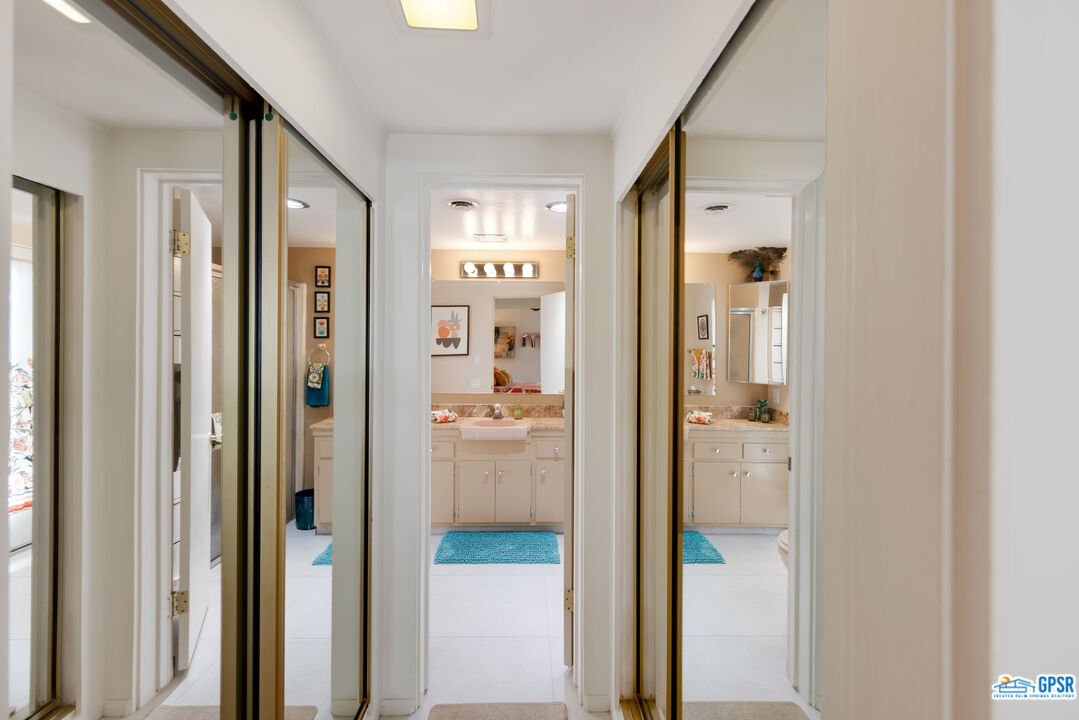 1655 Andee Drive Palm Springs, CA 92264 - Photo 12 of 23 a bathroom with a glass shower door
