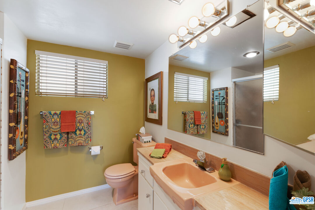 1655 Andee Drive Palm Springs, CA 92264 - Photo 13 of 23 a bathroom with a sink a toilet and a mirror
