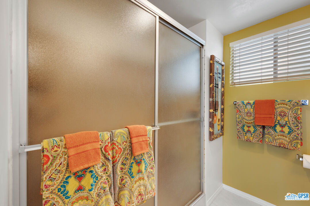 1655 Andee Drive Palm Springs, CA 92264 - Photo 14 of 23 a bathroom with a bathtub and a shower