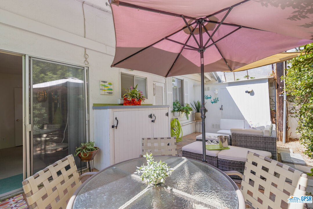1655 Andee Drive Palm Springs, CA 92264 - Photo 19 of 23 a dining room with furniture and wooden floor