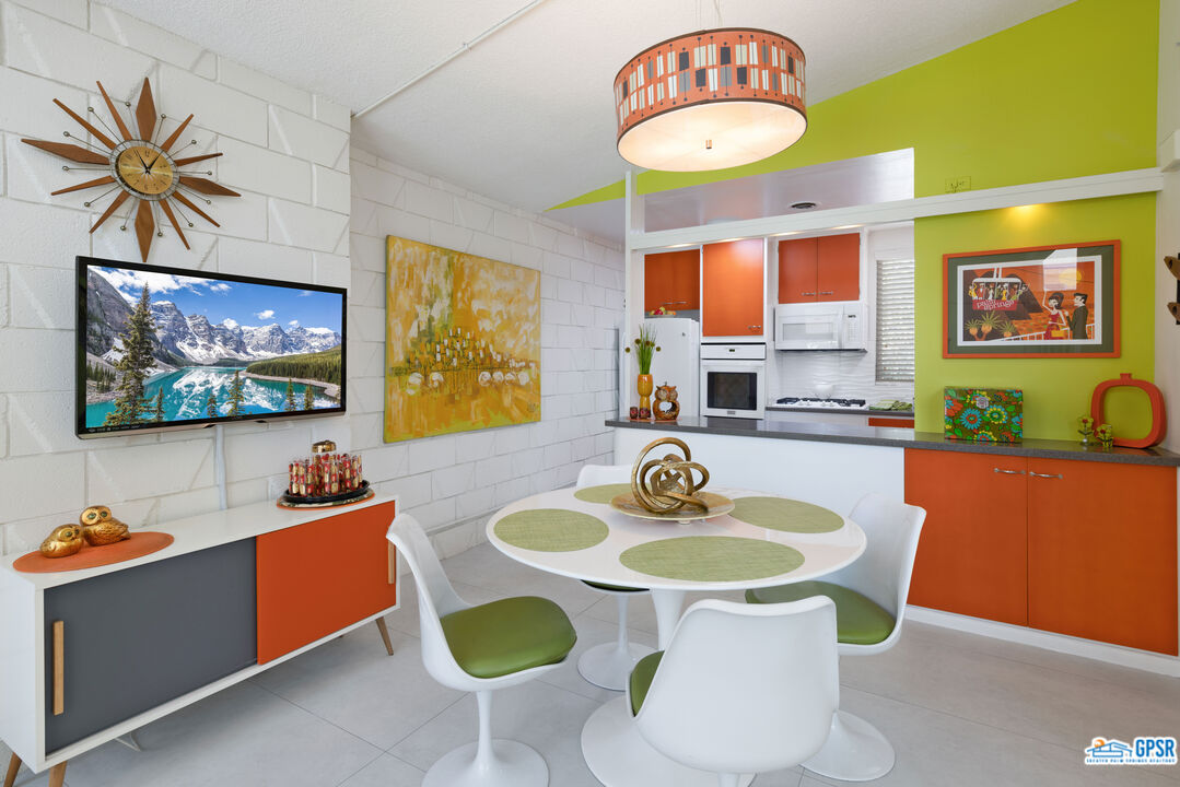 1655 Andee Drive Palm Springs, CA 92264 - Photo 2 of 23 a kitchen with a table and chairs