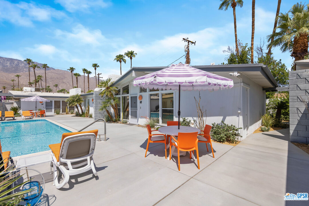 1655 Andee Drive Palm Springs, CA 92264 - Photo 22 of 23 a backyard of a house with table and chairs