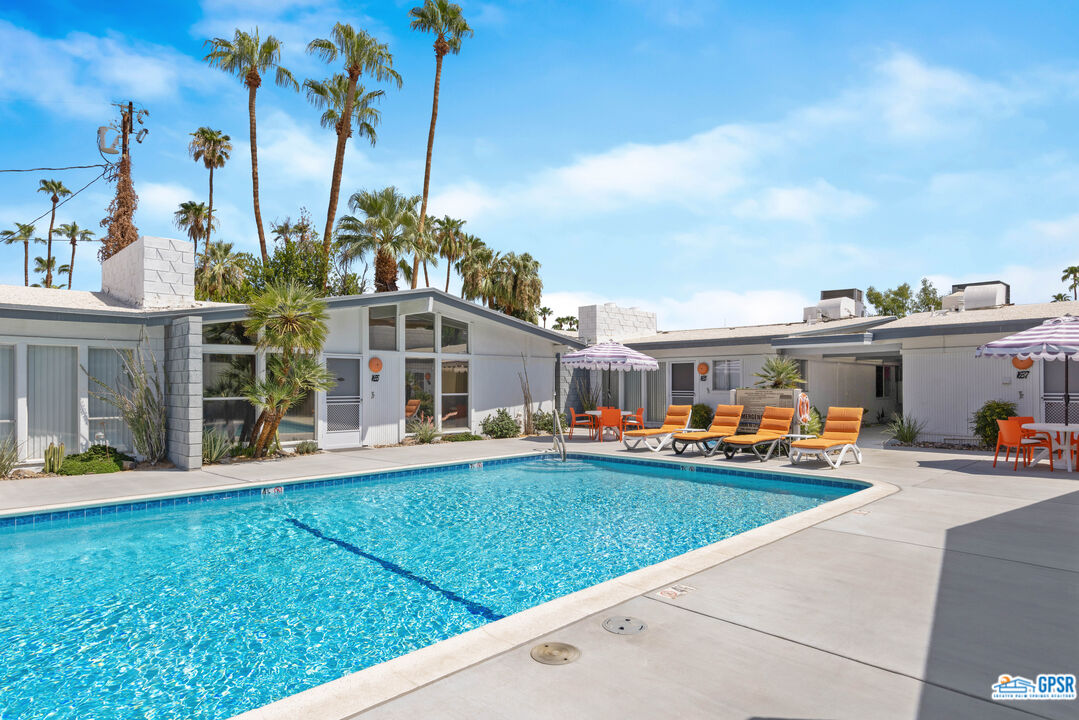 1655 Andee Drive Palm Springs, CA 92264 - Photo 23 of 23 a front view of a building with cars parked