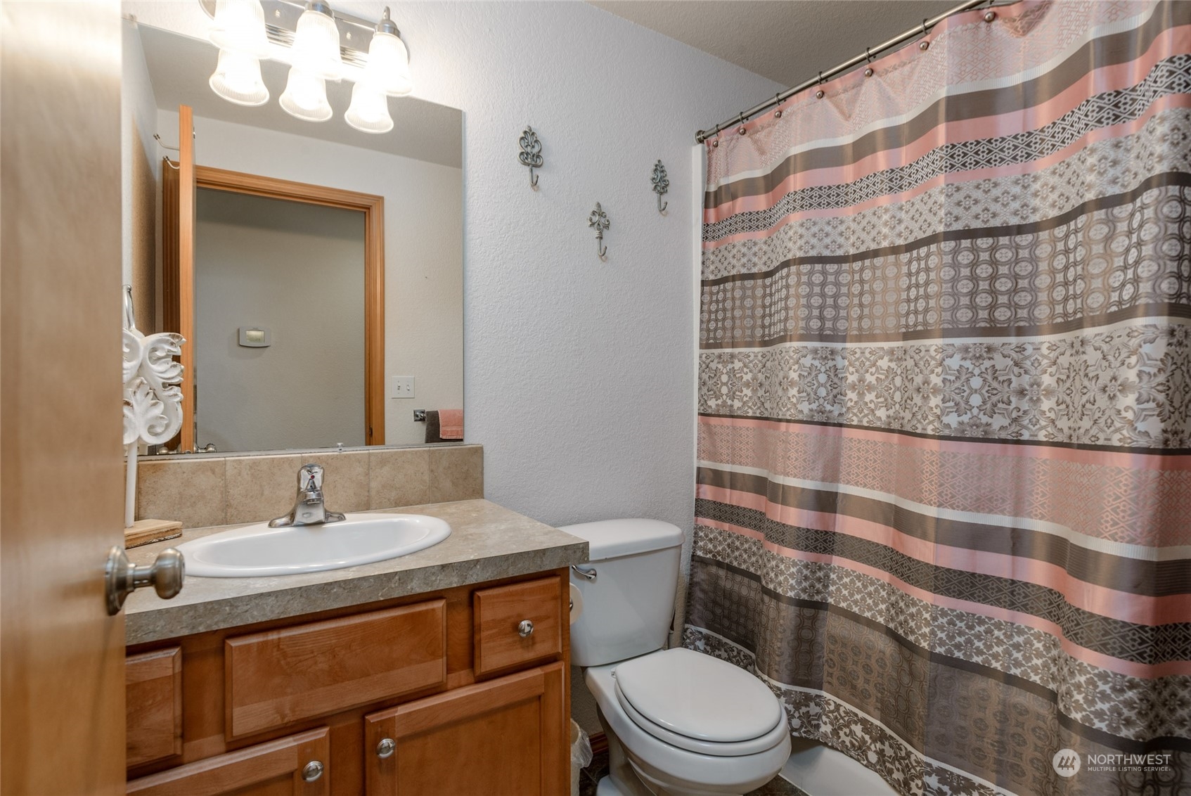 17914 Michelles Lane Southwest Rochester, WA 98579 - Photo 12 of 28 a bathroom with a sink a toilet and shower